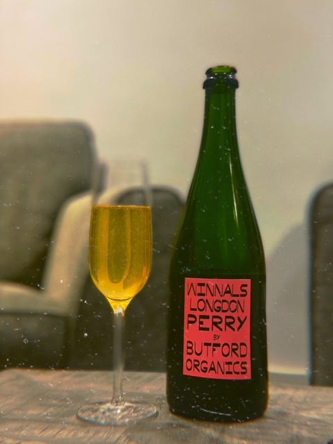 Image of a glass and a bottle of sparkling perry