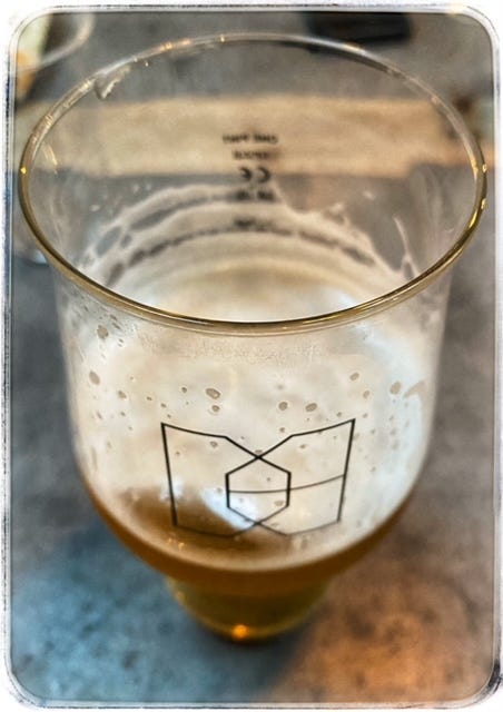 Image of a half drunken glass of beer