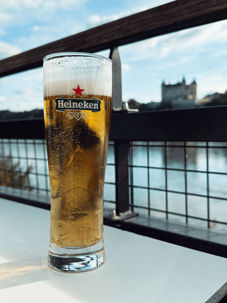 Image of a glass of Heineken beer on a table